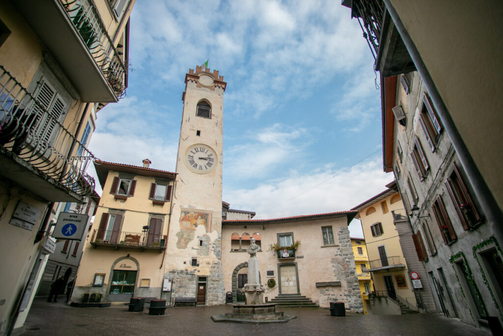 The iconic clock tower stands tall in the historic center of Lovere, Italy.