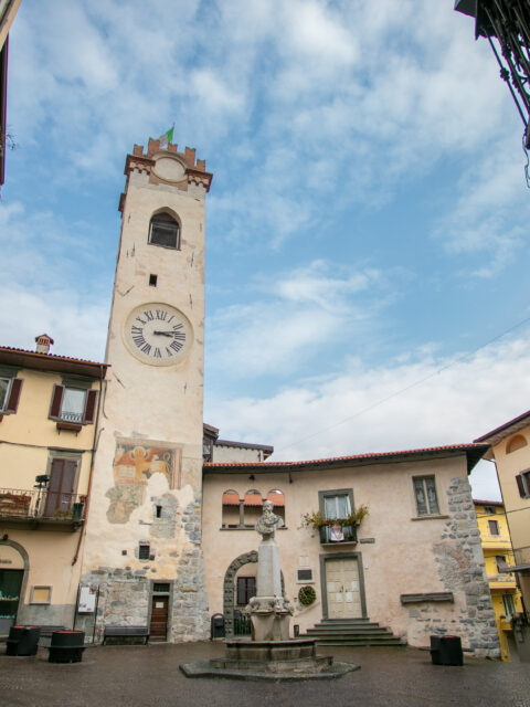 The iconic clock tower stands tall in the historic center of Lovere, Italy.