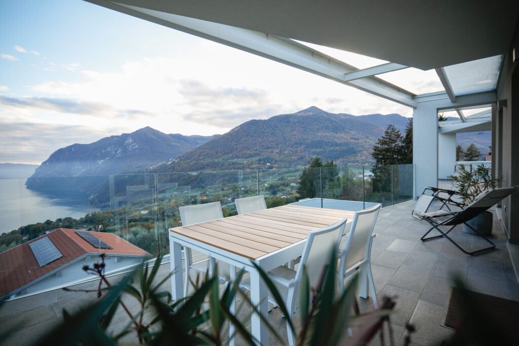 Modern terrace of Monti e Lago apartment overlooking Lake Iseo with Fabula Home Rental.