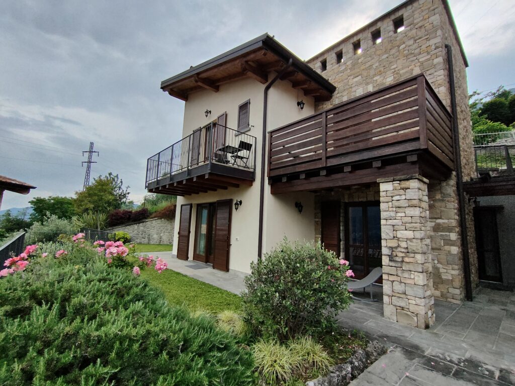 Elegant Casa Cuneo exterior with traditional stone and wood detailing by Fabula Home Rental