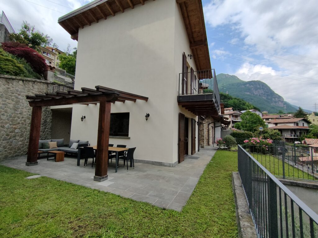 An inviting outdoor lounge area in Casa Cuneo's garden, offered by Fabula Home Rental