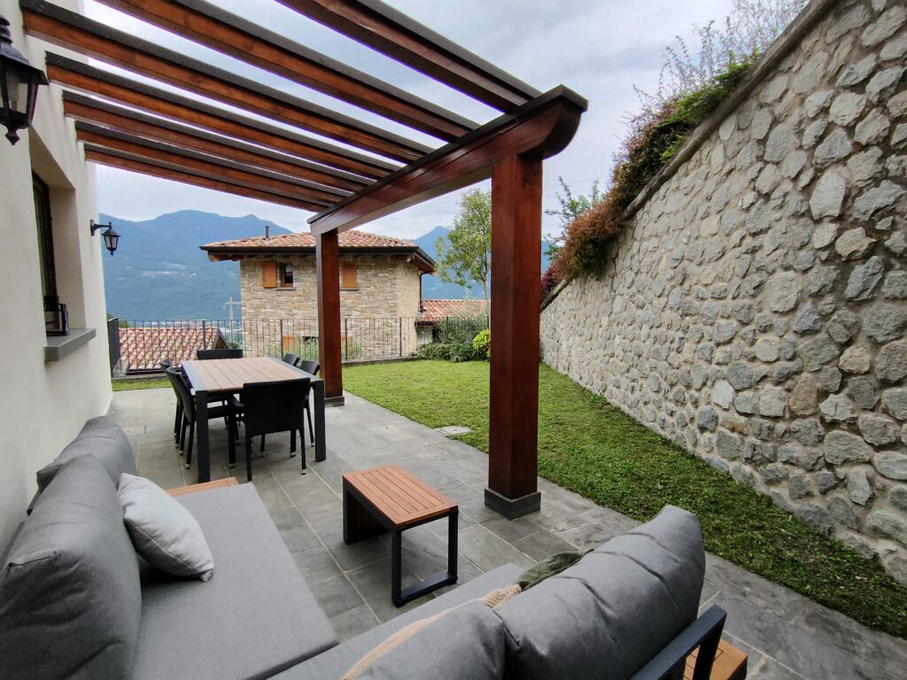 Casa Cuneo's outdoor area featuring a magical mountain backdrop by Fabula Home Rental