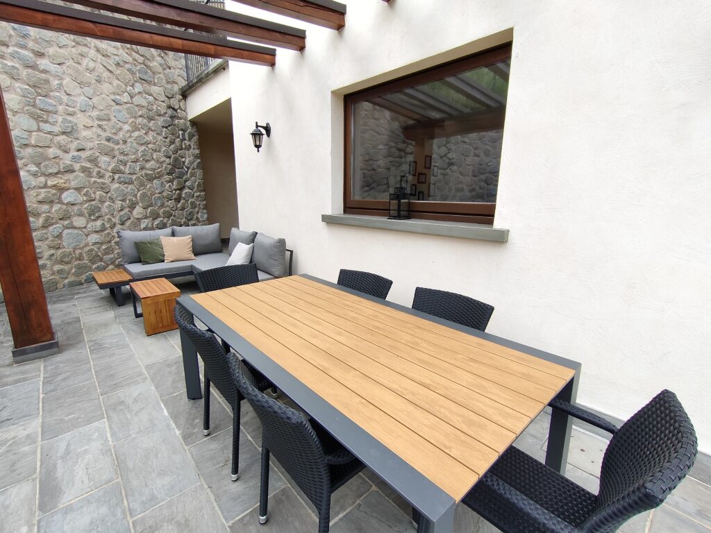 Tranquil outdoor dining and relaxation area at Casa Cuneo by Fabula Home Rental