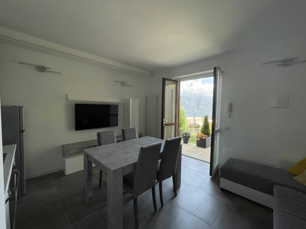 Chic living and dining space with modern amenities at Casa il Nido by Fabula Home Rental