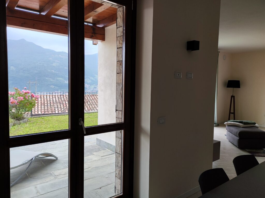 Open window with mountain view at Fabula Home Rental, blending outdoor beauty with indoor elegance