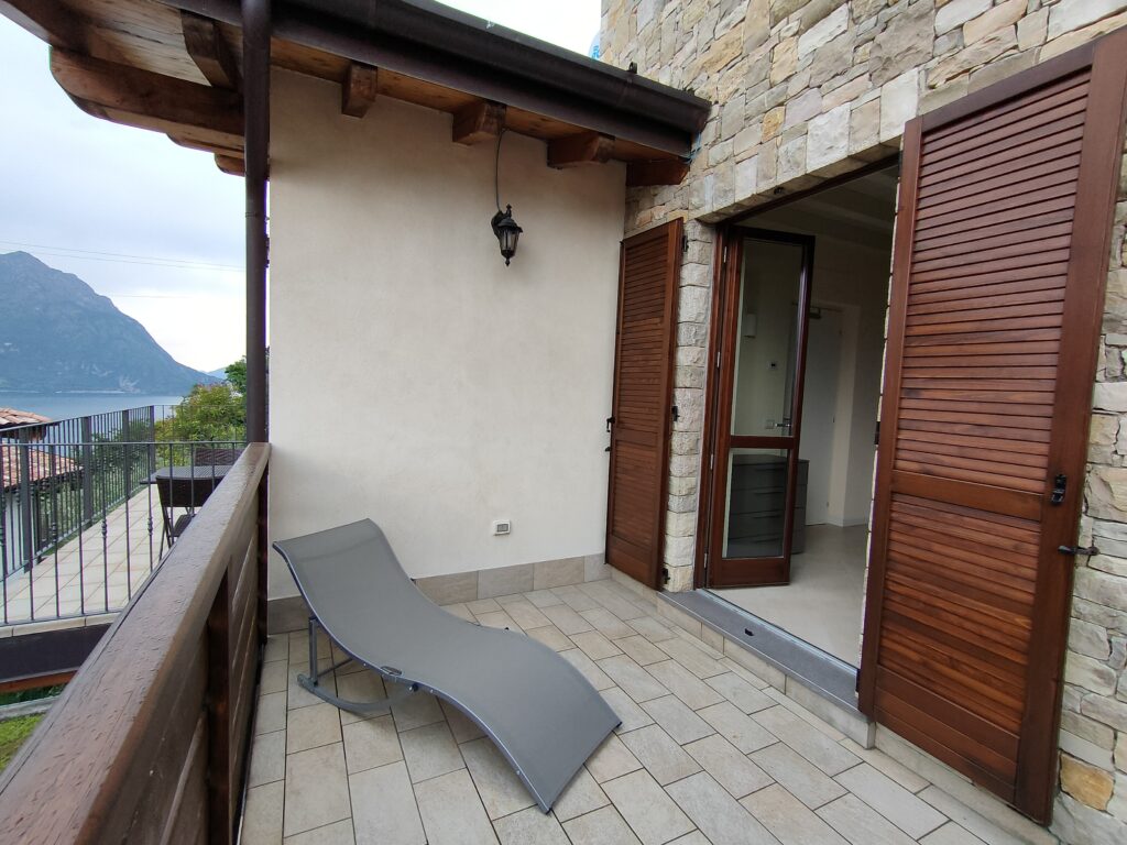 Relaxing terrace with a serene view at a Fabula Home Rental property by Lake Iseo