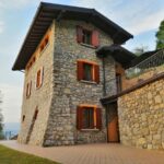 Charming stone villa with balcony overlooking Lake Iseo at Fabula Home Rental