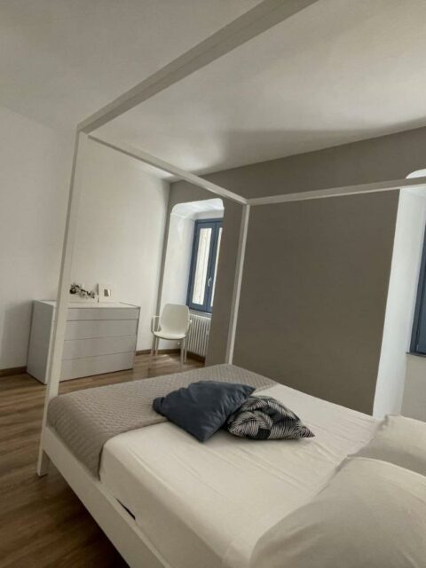 Canopy bed in the master bedroom at Palazzo Cinquecento by Fabula Home Rental