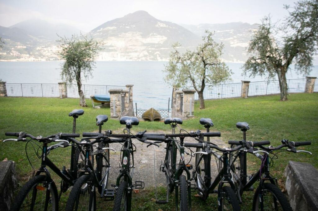 A lineup of bicycles facing the enchanting Lake Iseo at La Stallina Ground Floor