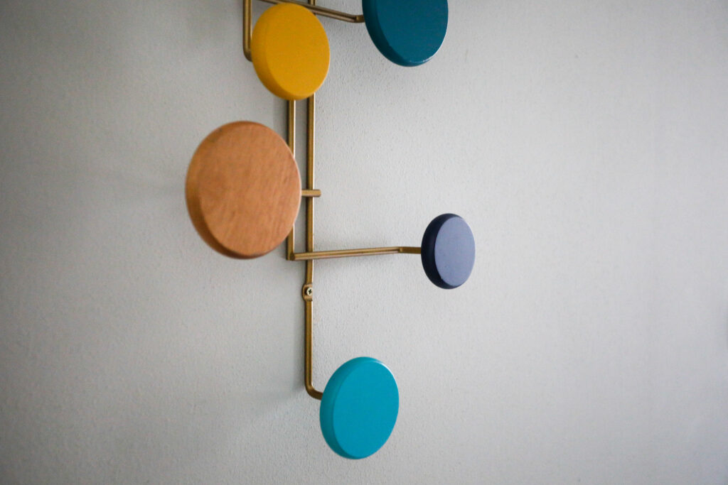 A playful array of modern wall hooks in various colors and sizes