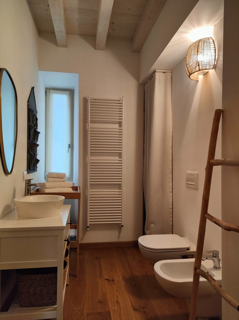 Elegant bathroom with modern amenities and wooden accents in Lakeview Apartment