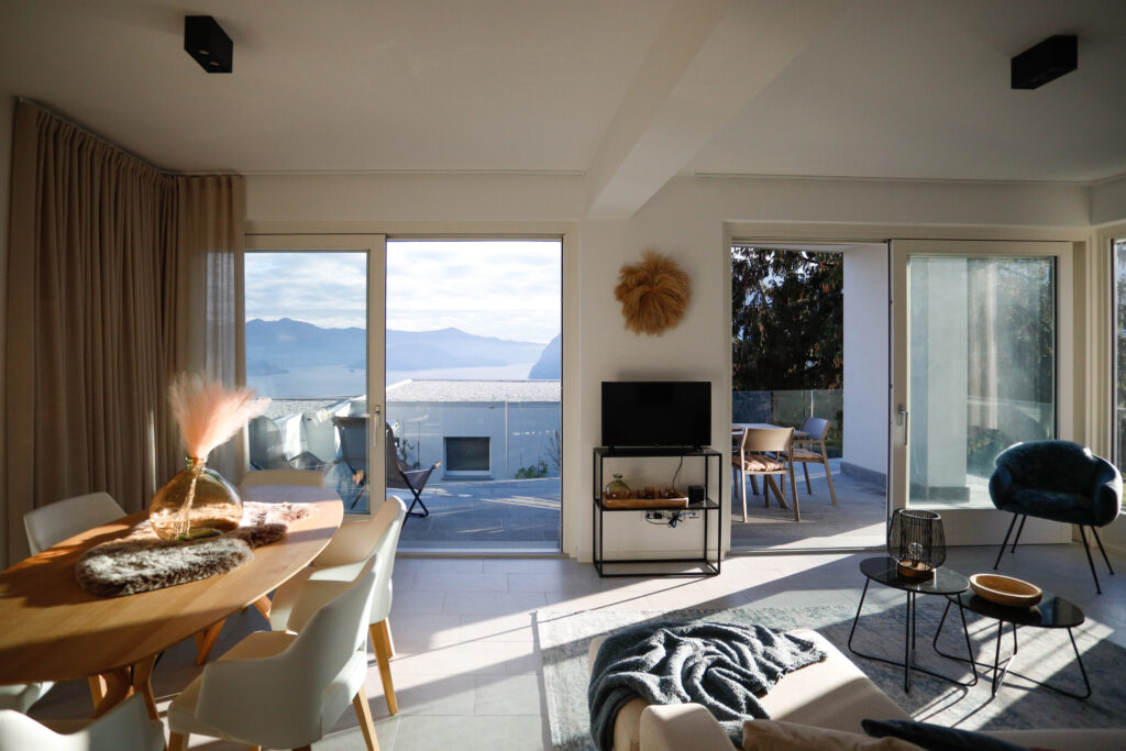 Panoramic lake view from the combined dining and living area at Seliera, Iseo Lake