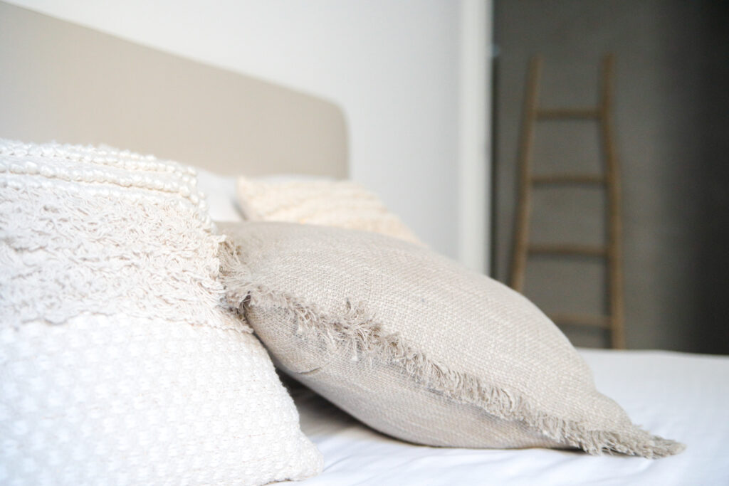 Cozy bedroom pillows on a bed in Seliera, Iseo Lake's luxury retreat