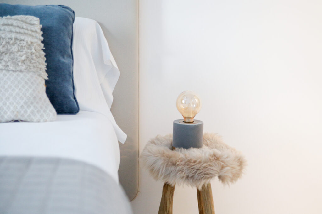 Elegant bedside lamp with a fur accent in Seliera, embodying the luxury of Lake Iseo's retreats