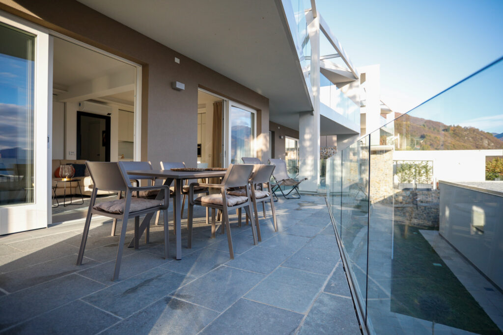 Modern outdoor seating area with a view of Lake Iseo at Seliera