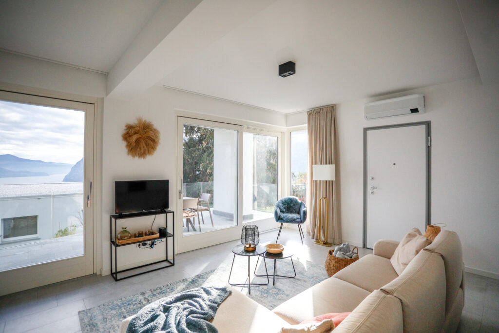 Spacious living room at Seliera with panoramic iseo lake views and stylish decor