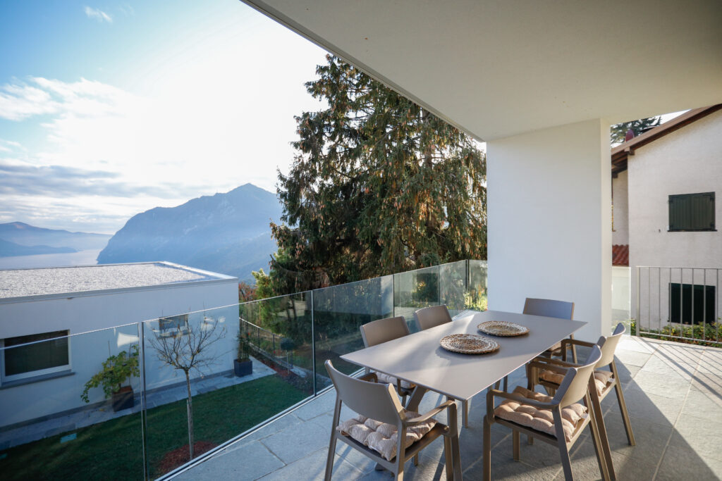 An inviting dining setup on Seliera's terrace overlooking Iseo Lake