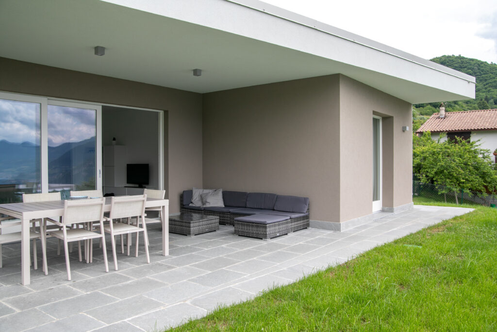 Contemporary outdoor lounge area at Trivia Resort with scenic views of Lake Iseo