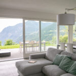 Serene living room at Trivia Resort with expansive views of Lake Iseo