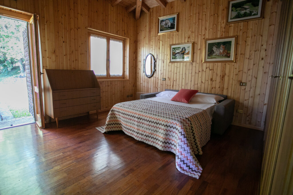 Villa Simone bedroom with direct access to the garden through French doors