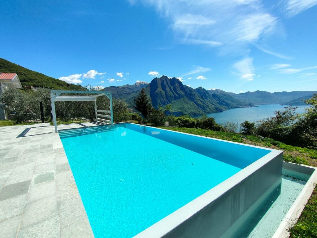 Luxurious poolside relaxation area at Wonder House with stunning landscape views