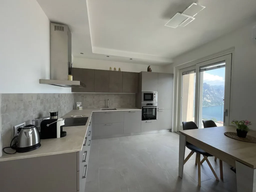 Sleek and fully equipped kitchen at Wonder House with a lake view