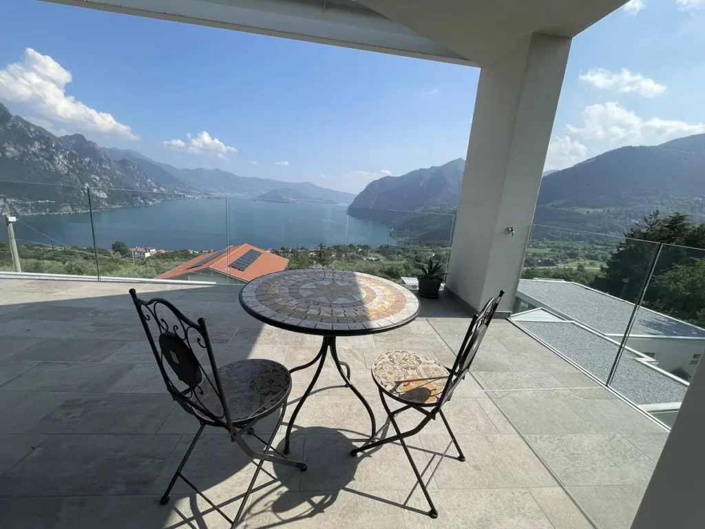 Serene sunset view from Wonder House's terrace overlooking Lake Iseo