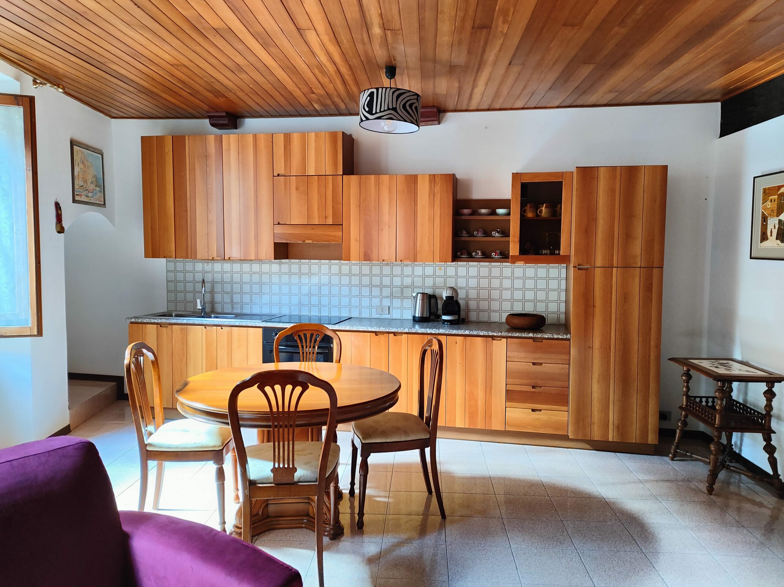 Dining area with wooden furniture in La Porta Sul Lago apartment, Riva di Solto